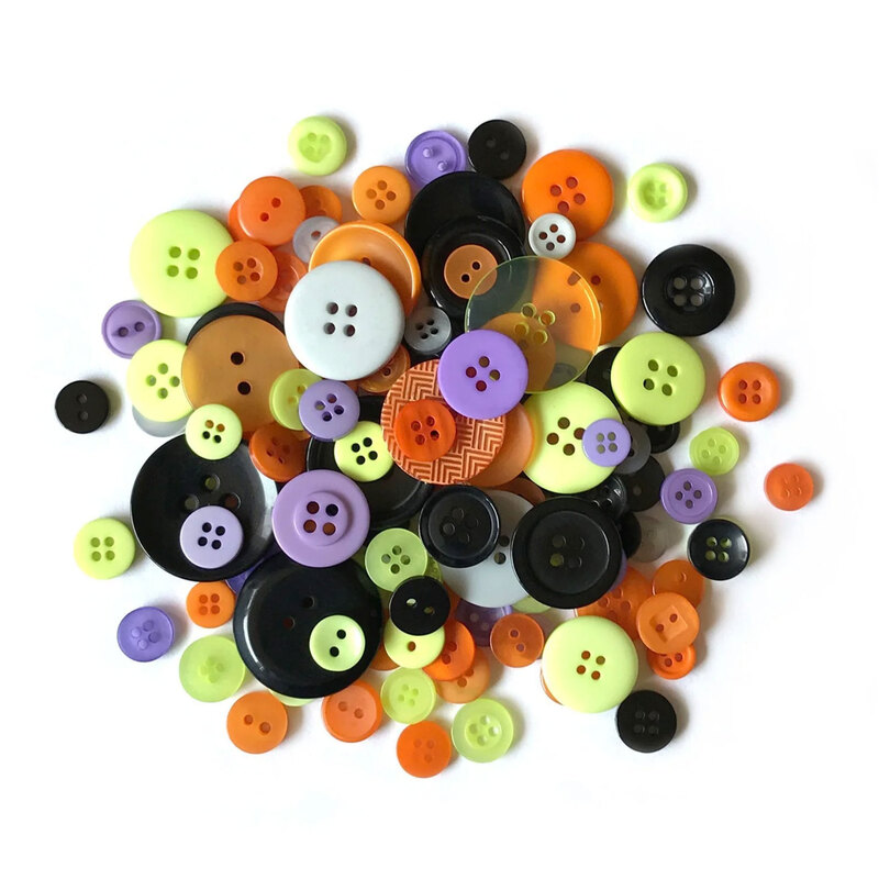 A pile buttons in halloween colors in a variety of sizes.