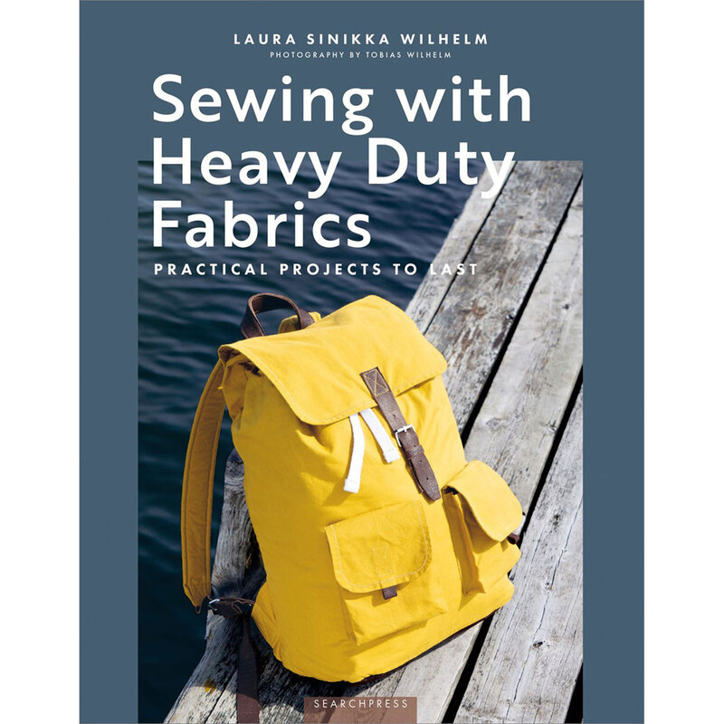 The front cover of the Sewing With Heavy Duty Fabrics Book showing a yellow backpack on a wooden dock on the water.