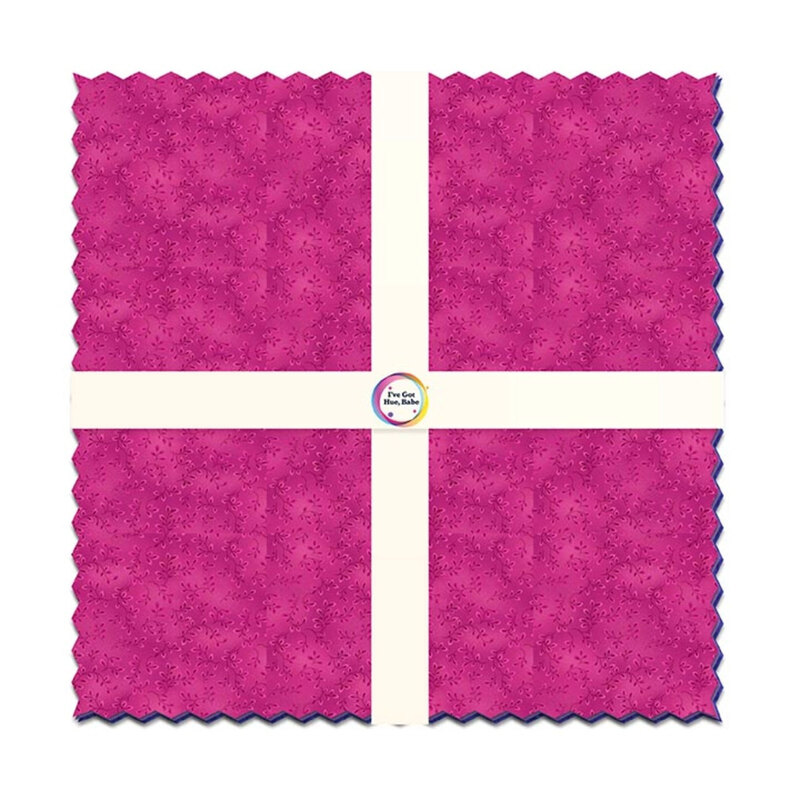 Layer cake with white ribbon design crossing the center.