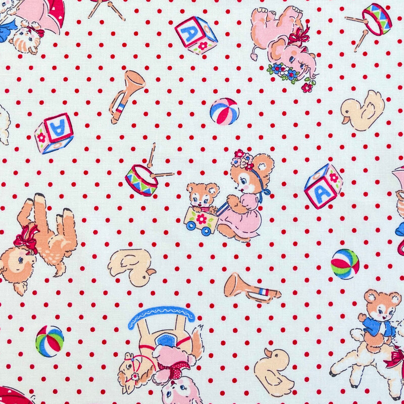 White fabric with a vintage-inspired design of cartoon animals and other childhood motifs scattered across a background of red dots.