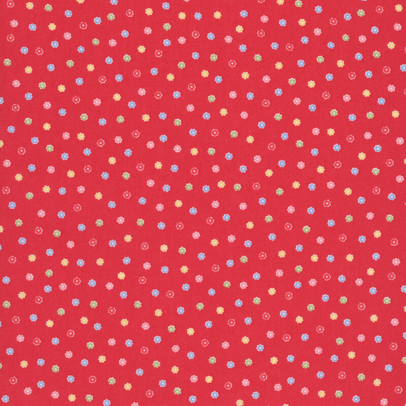 Bright red fabric with a scattered pattern of colorful flower buds.