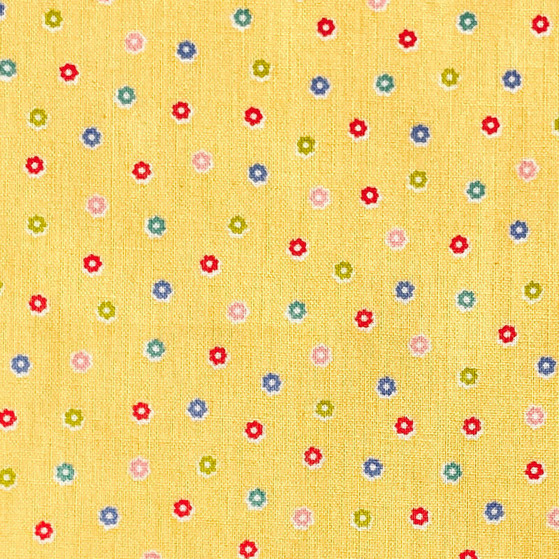 Yellow fabric with a scattered pattern of colorful flower buds.