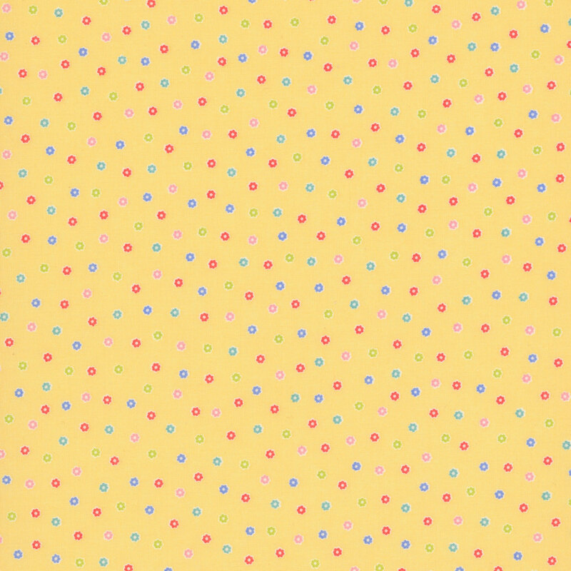 Yellow fabric with a scattered pattern of colorful flower buds.