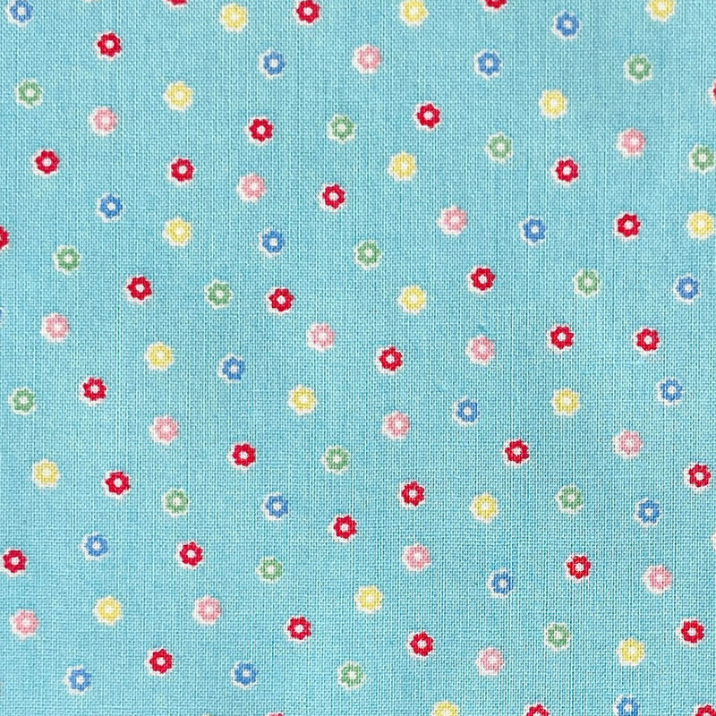 Light blue fabric with a scattered pattern of colorful flower buds.