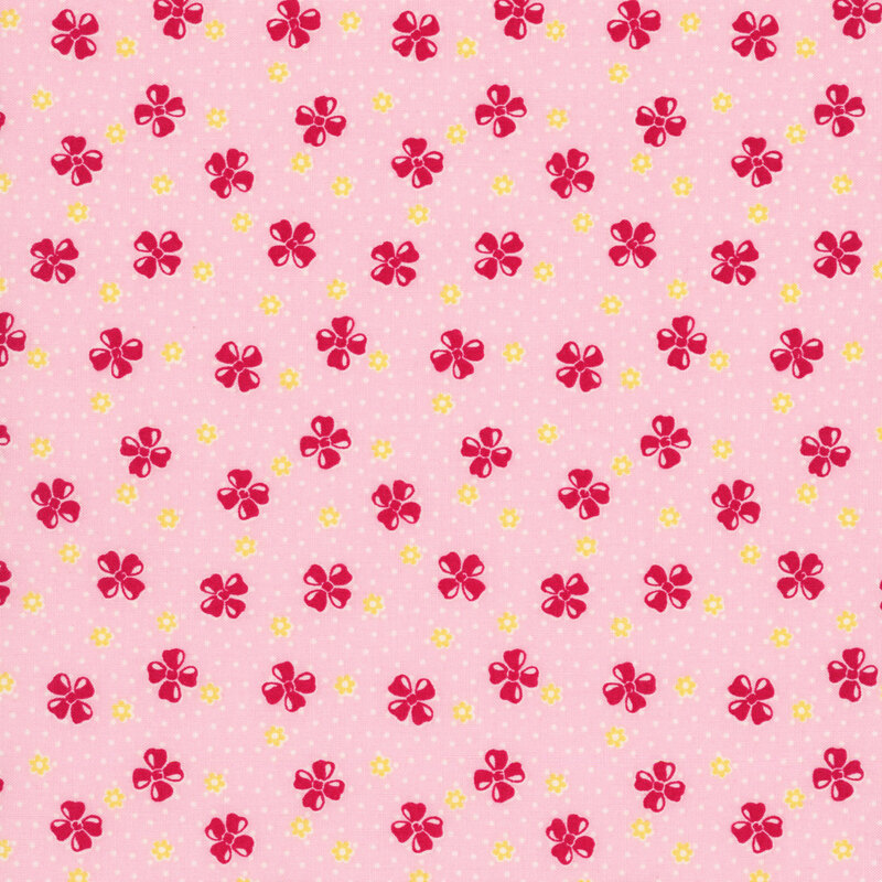 Pink fabric features a vintage-style pattern of floral buds set against a dotted background.
