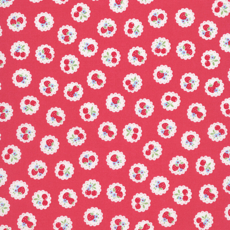 red fabric with a pattern of vintage-style medallions filled with assorted fruits like cherries and strawberries.