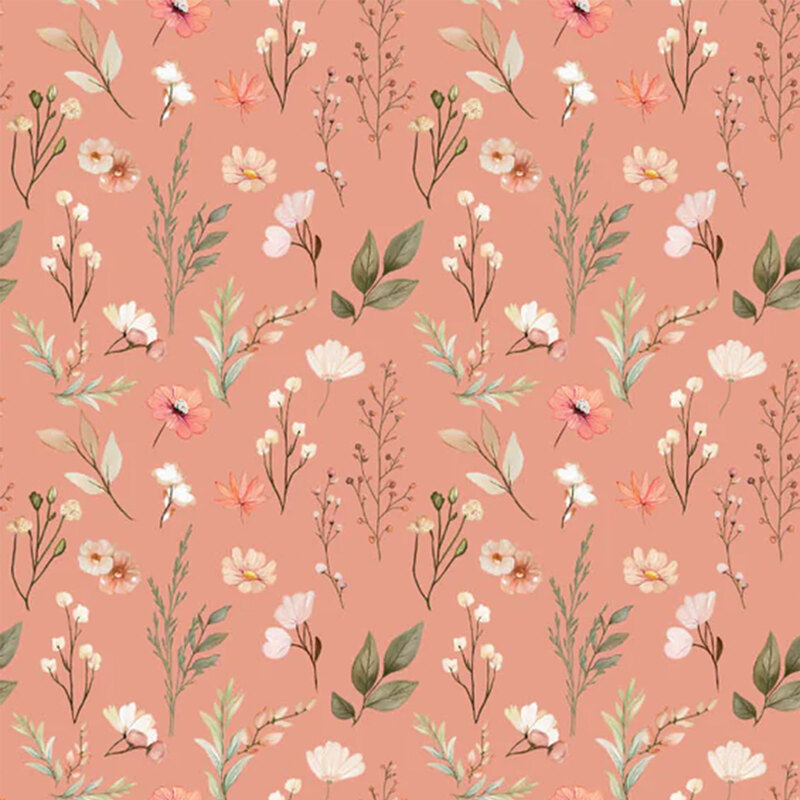 Salmon pink fabric with a pattern of leafy stems and desert flowers 