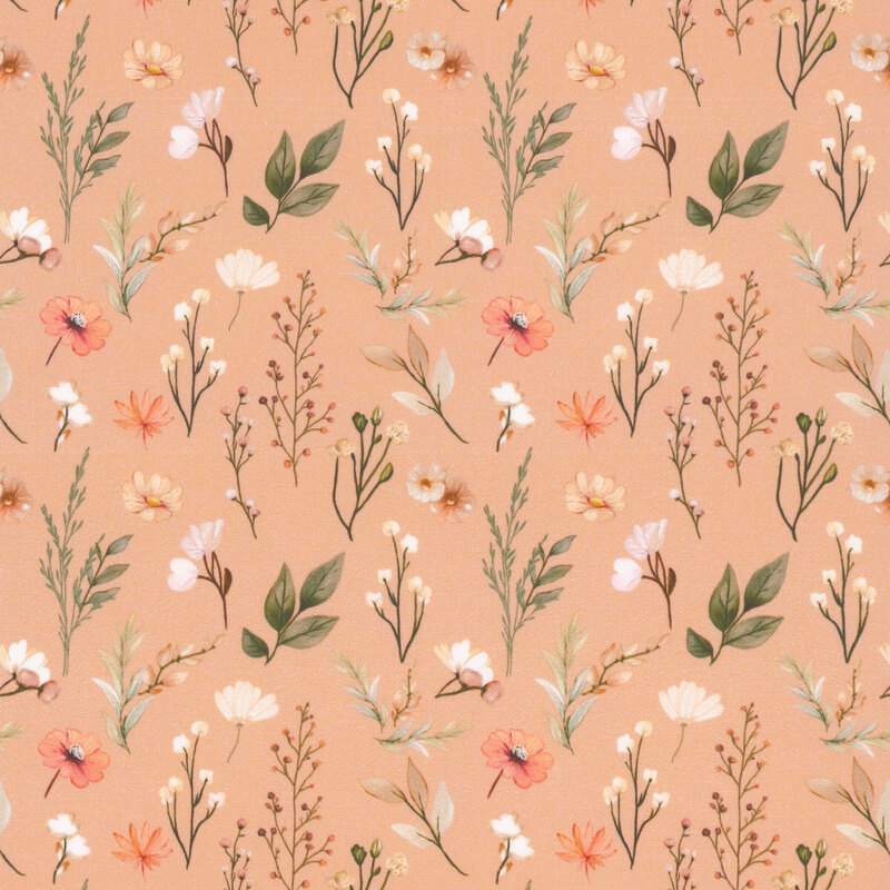 Salmon pink fabric with a pattern of leafy stems and desert flowers 