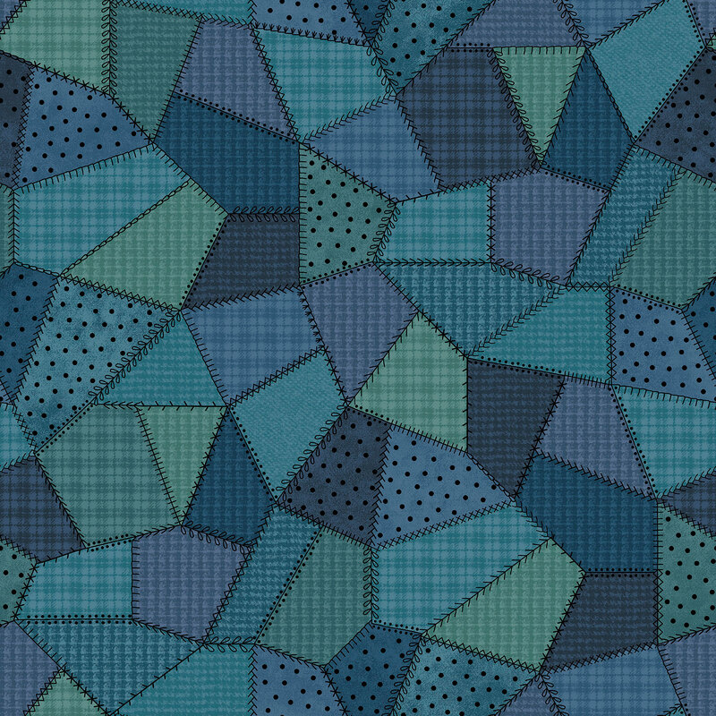 Blue-scale fabric ranging from navy to teal with many different patterns of flannel and dots. 