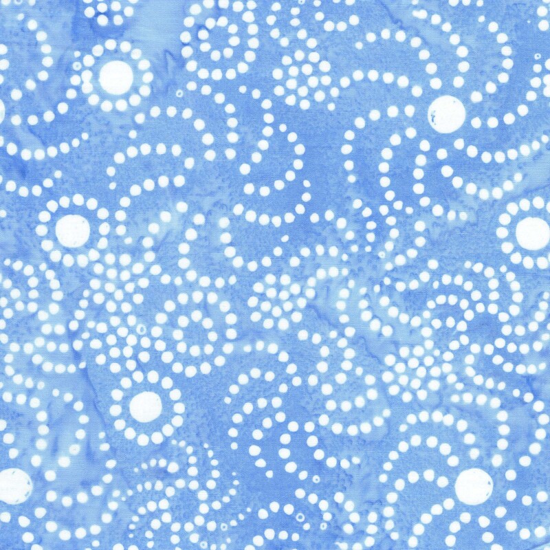 Watercolor sky blue batik fabric with a white overlay of circles and dots in whirl designs