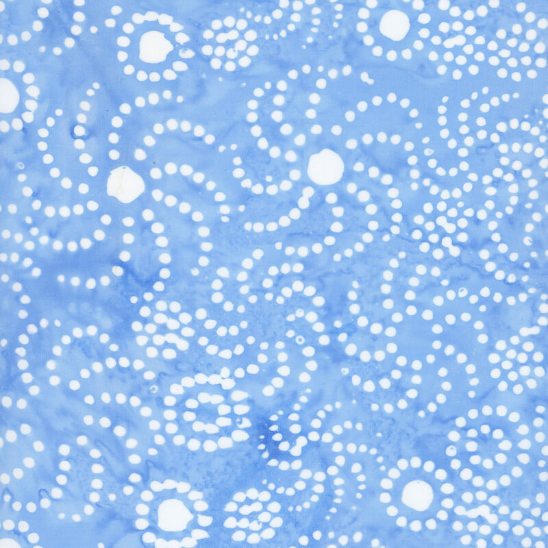Watercolor sky blue batik fabric with a white overlay of circles and dots in whirl designs