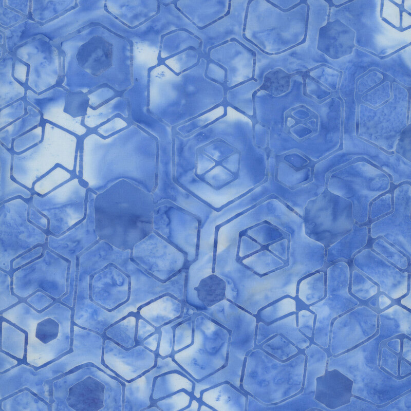 blue and white mottled fabric with a faded denim blue overlay of hexagons and cube shapes
