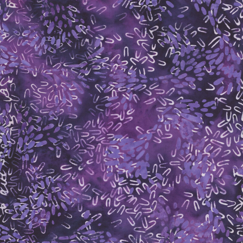Mottled dark purple fabric with scattered petal and hairpin shaped motifs in hues of white and mottled violet.