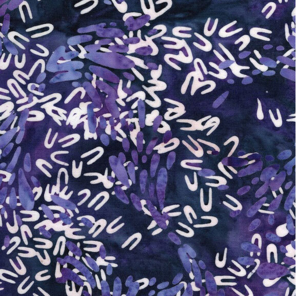 Mottled dark indigo fabric with scattered petal and hairpin shaped motifs in hues of white and mottled wisteria.