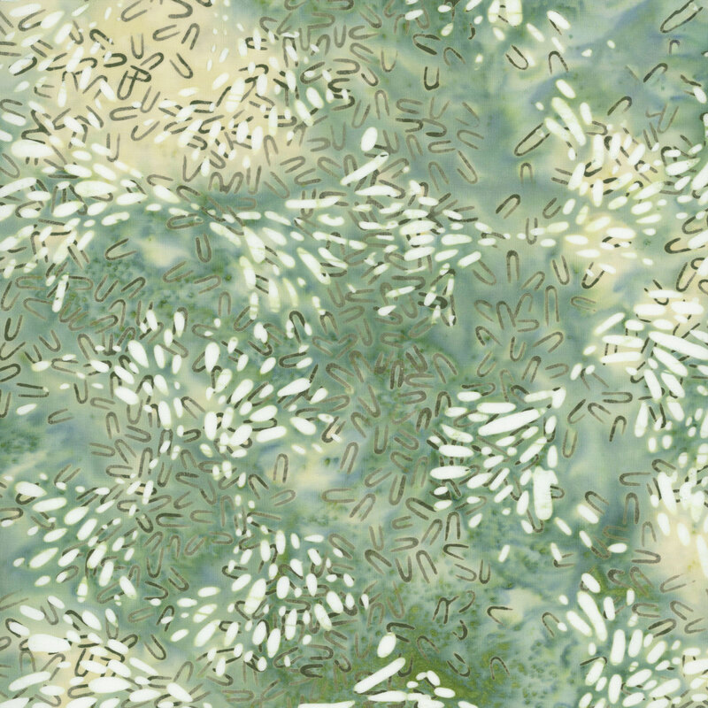 Mottled cool sage and juniper fabric with scattered petal and hairpin shaped motifs in hues of white and phthalo green.