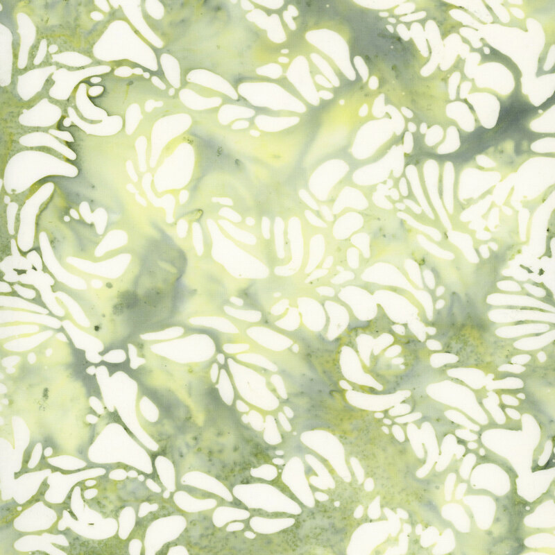 Mottled celery green fabric with white organic shapes scattered throughout.