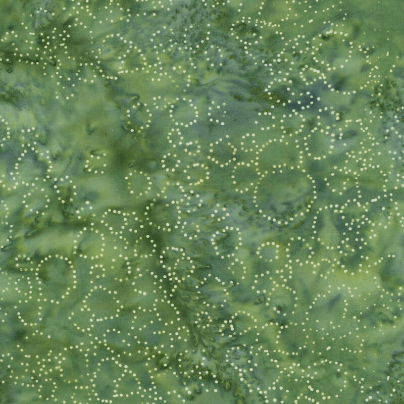 Blue green mottled fabric with dotted circles scattered throughout.
