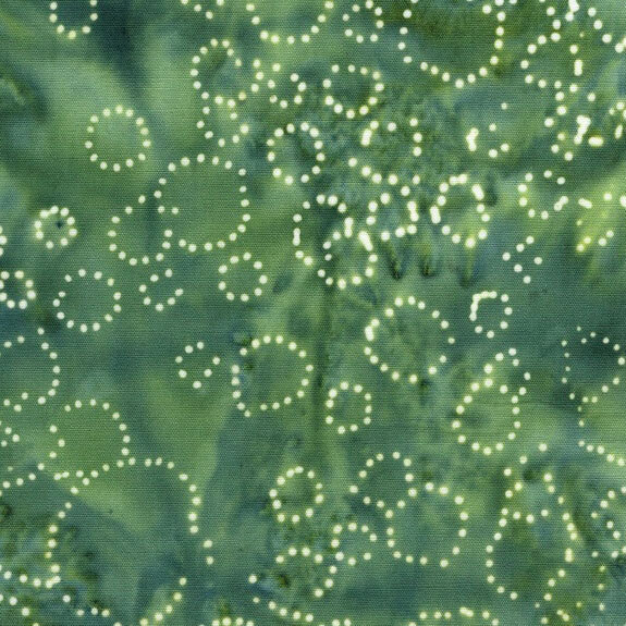 Blue green mottled fabric with dotted circles scattered throughout.