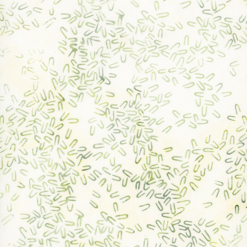 Textured white fabric with mottled green hairpin shaped motifs scattered throughout.