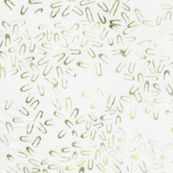 Textured white fabric with mottled green hairpin shaped motifs scattered throughout.