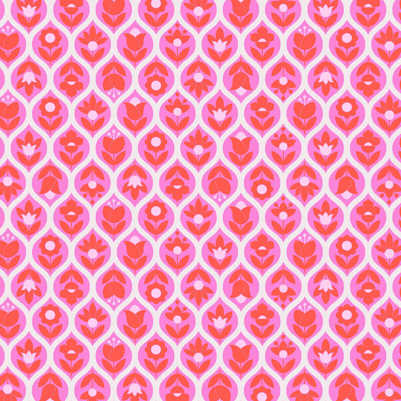 This white fabric features an hot pink ogee lattice filled with stylized floral and leaf motifs.