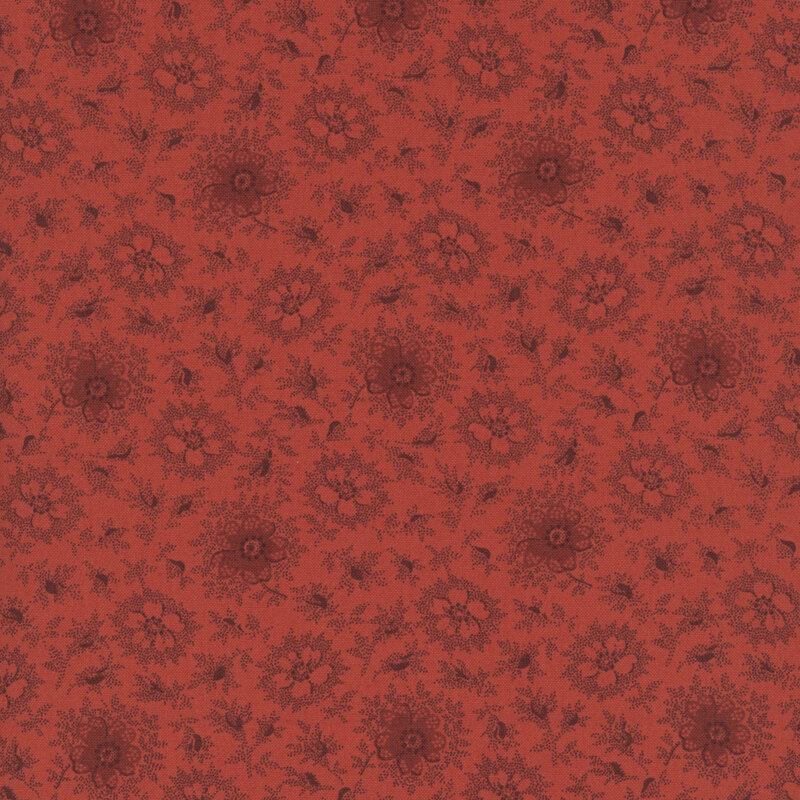 Ruby red fabric with a primitive pattern of light and dark daisies with deep red accents