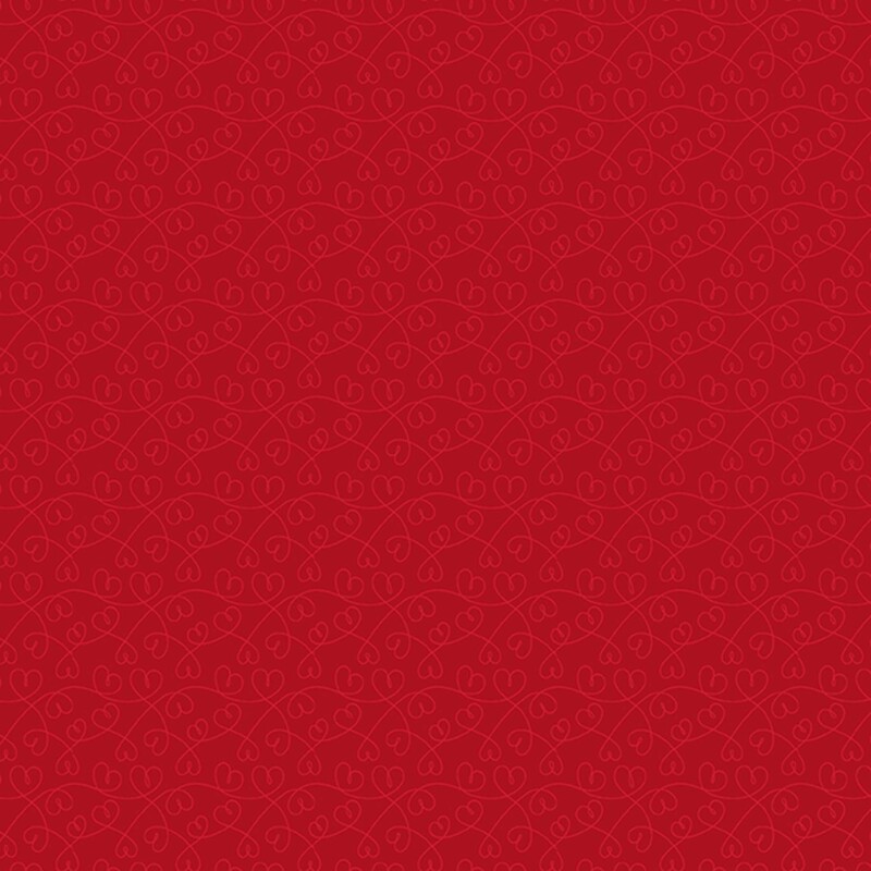 Garnet red fabric featuring swirling tonal lines with hearts