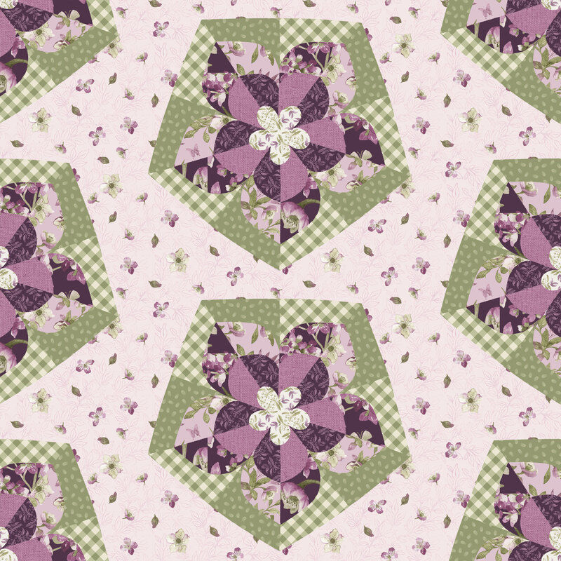 Multicolored flower patches on top of a soft pink fabric tossed with flowers and leaves.
