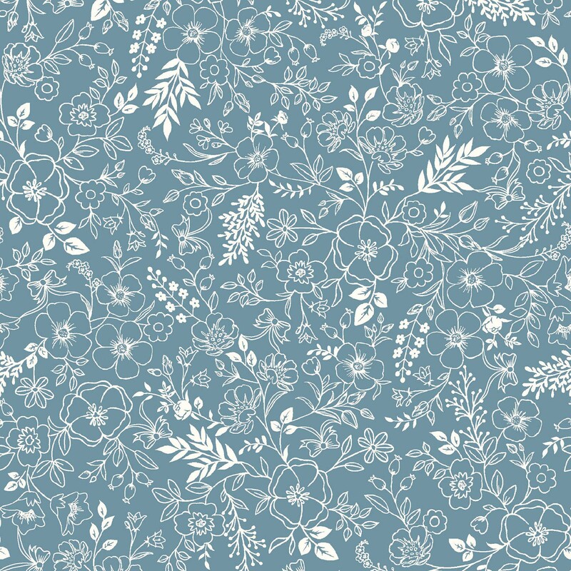Denim blue fabric with a cream pattern of floral and leafy outlines