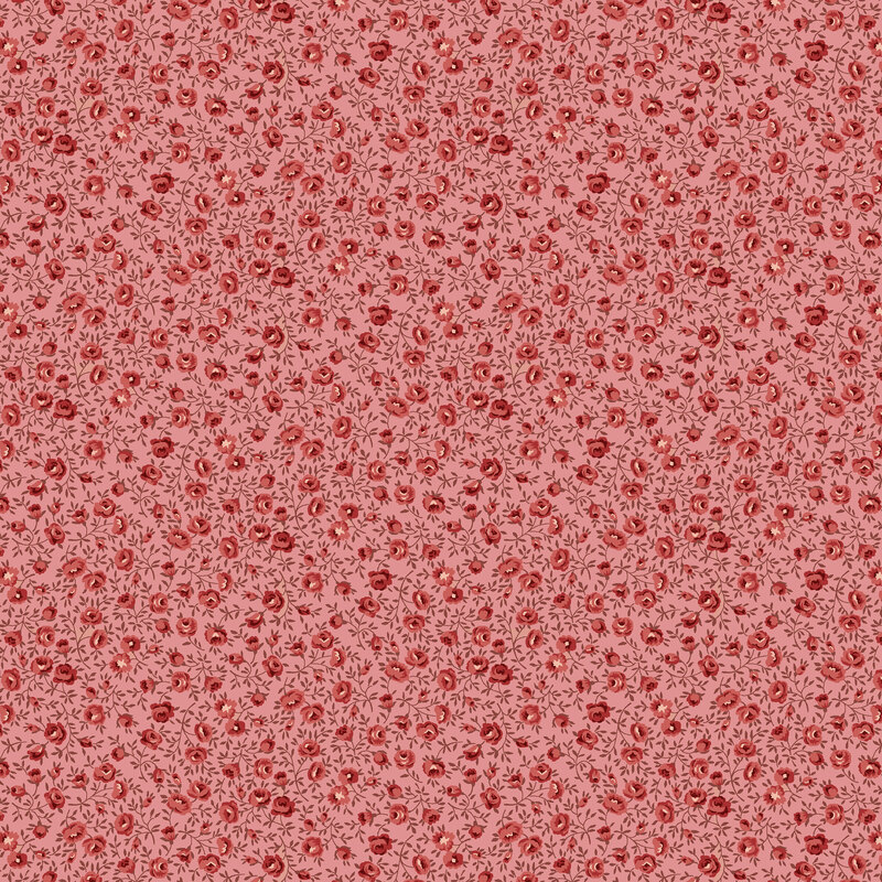 Pink calico fabric with red rose buds.