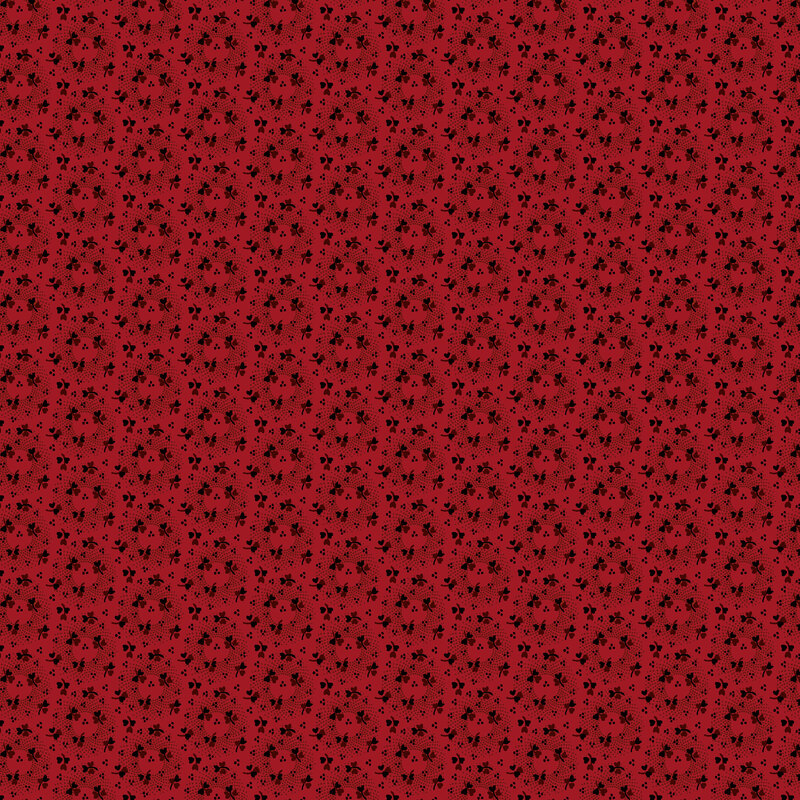 Dark red fabric with staggered pattern of dotted circles tossed with stylized wine red roses.