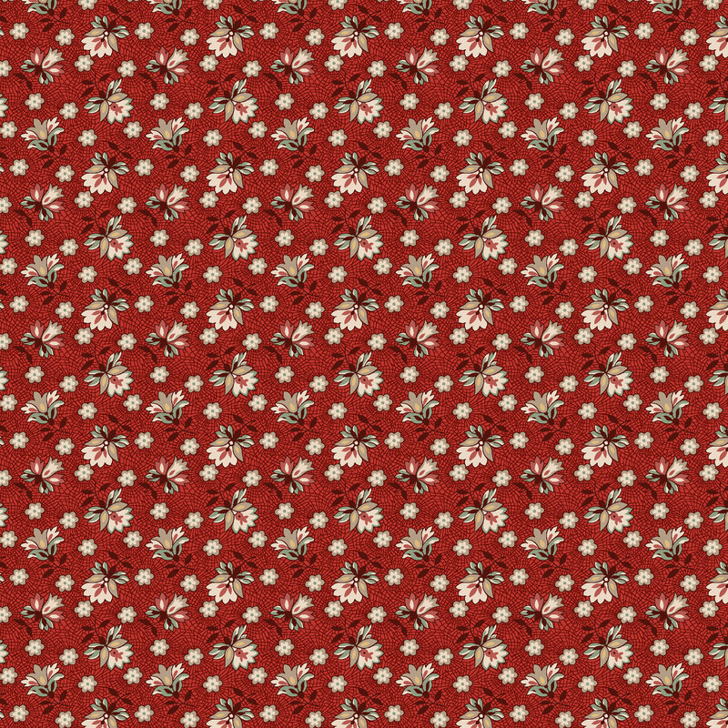 Red fabric with alternating tossed florals connected by an intricate lace design.