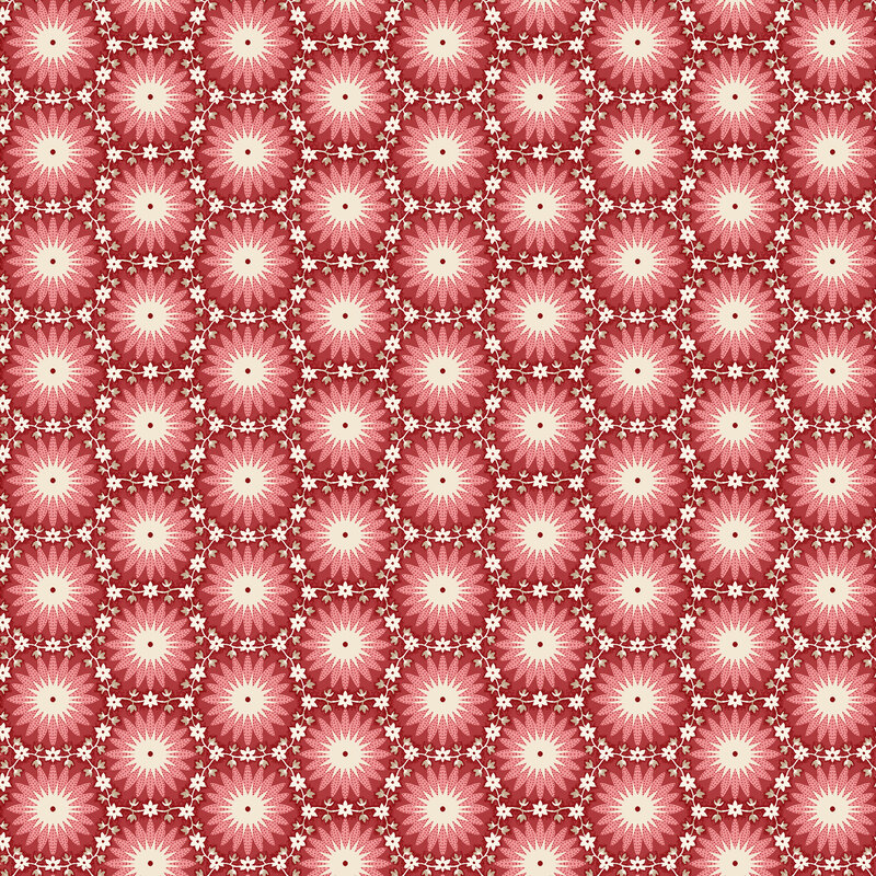 Red fabric with hexagonal cream and pink sunburst pattern, separated by white and tan vines and florals.