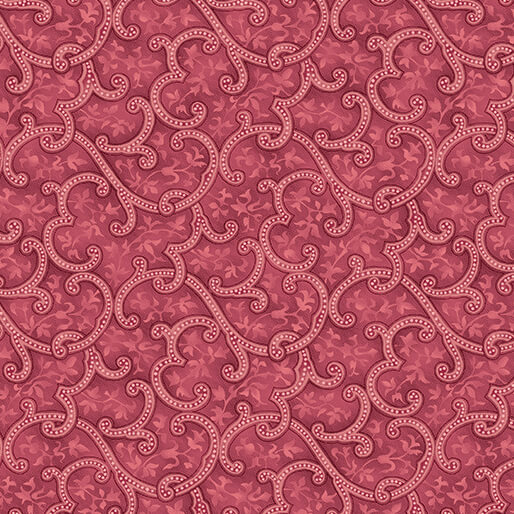 Intricate swirls and floral motifs on a mottled magenta red fabric.