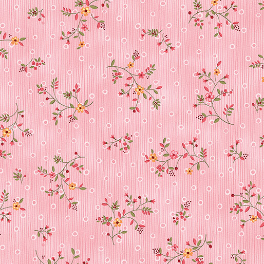 Pattern of small floral designs in varying colors on a pink background with white open circles.