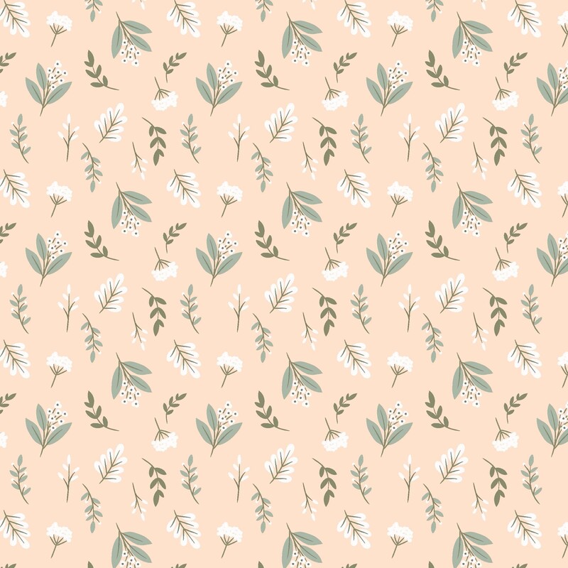 Pastel peach fabric with tossed white florals and green leafy sprigs