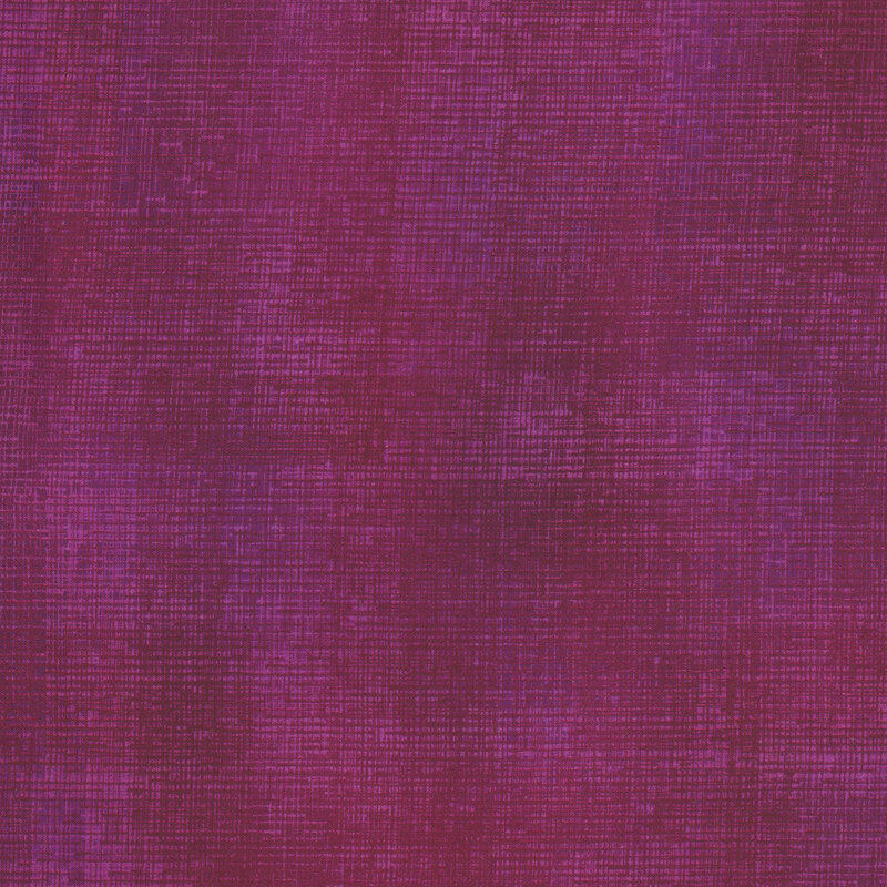 Swatch of magenta fabric with tonal thatched texturing.