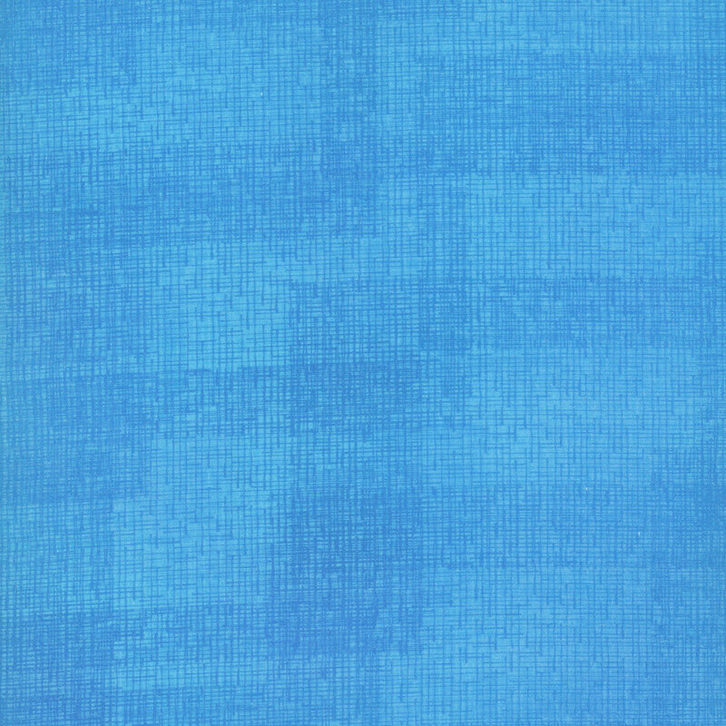 Swatch of azure fabric with tonal thatched texturing.