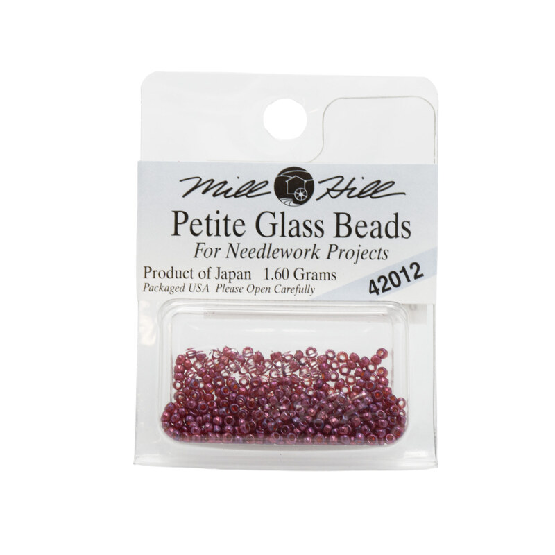 A package of Mill Hill Petite Seed Beads in the color royal plum. 