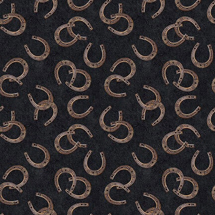Tossed horseshoes on a textured black background.