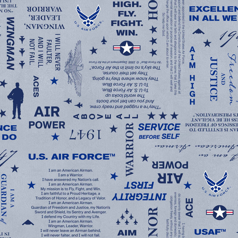 Mottled powder blue fabric with a tossed pattern of Air Force-themed motifs, including logos, the Oath of Service, slogans, and other military-inspired designs.
