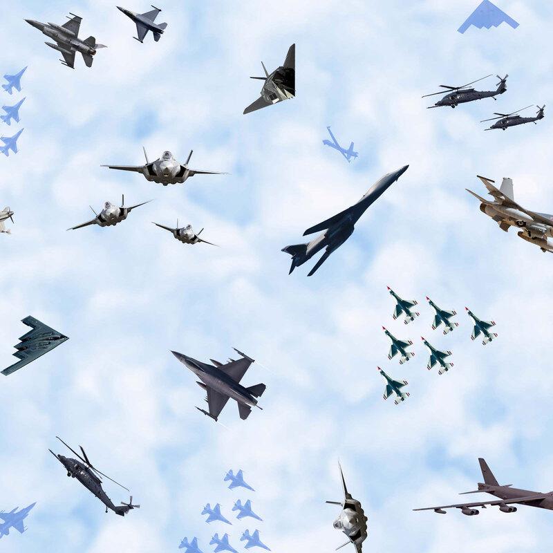 Mottled blue fabric with a tossed pattern of Air Force fighter jets and assorted aircraft in flight.