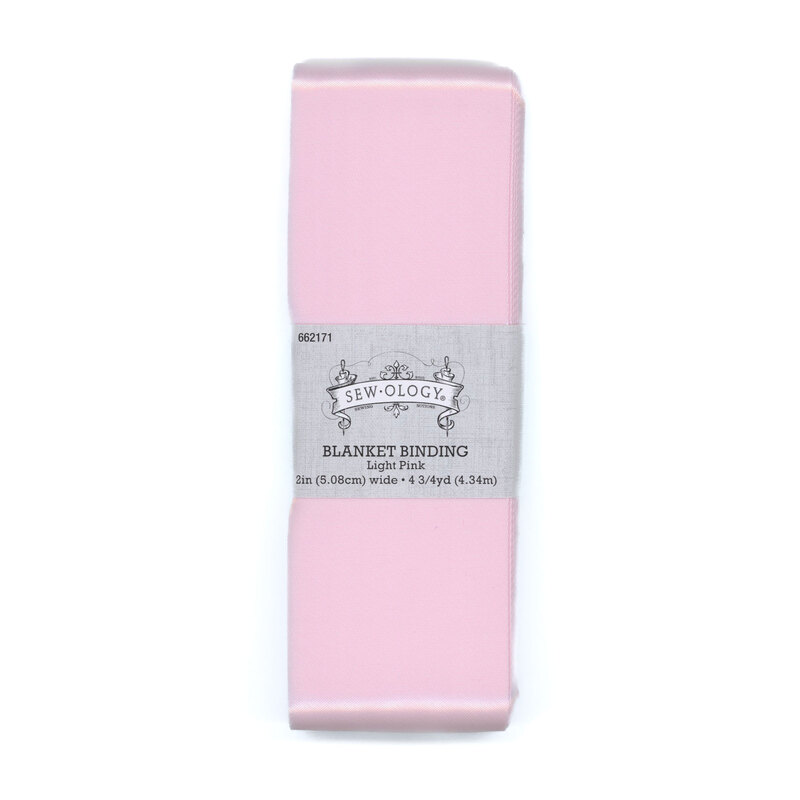 Baby pink binding tape in its packaging, isolated on a white background.