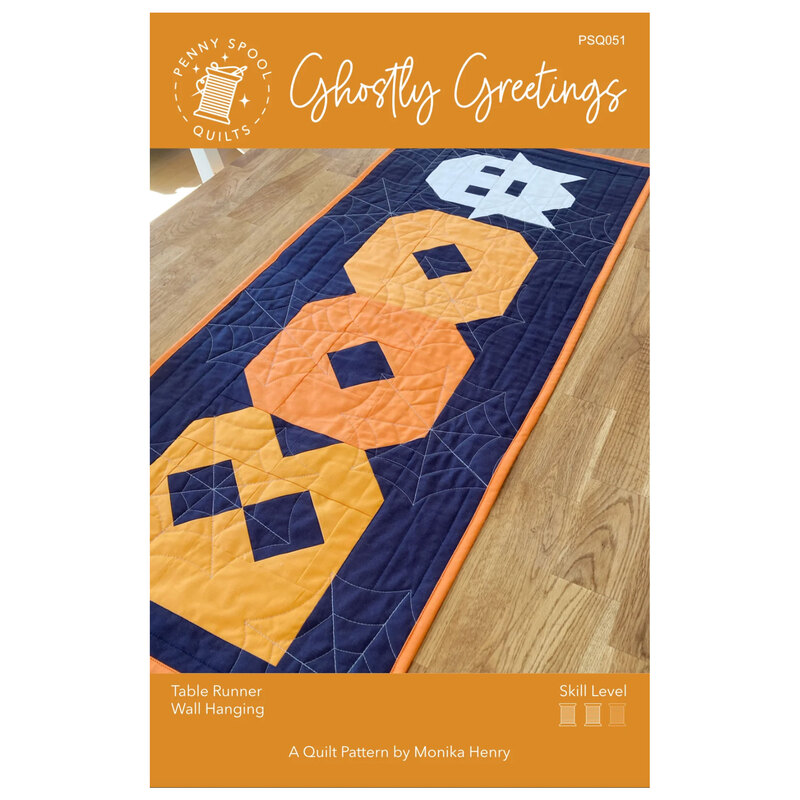 The front of the Ghostly Greetings pattern showing the finished halloween table runner. 