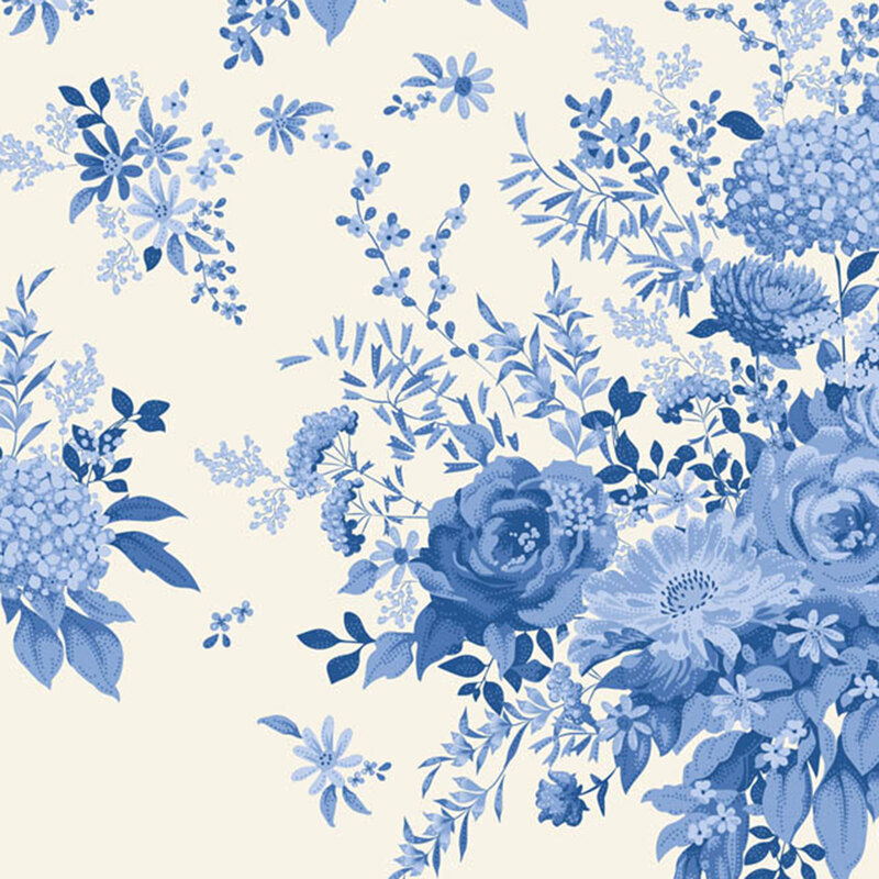 Toile cream fabric with large blue floral clusters and leaves in a classic, richly detailed design.