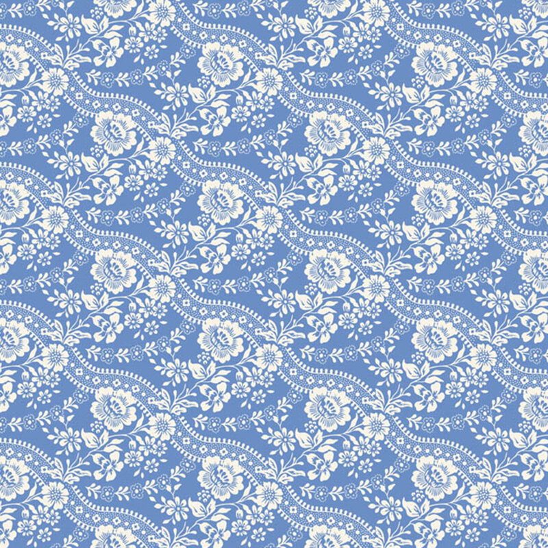 Blue fabric with stripes of stylized flowers paired with wavy lines for a graceful, flowing design.