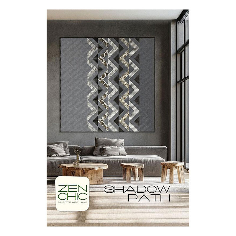 The front cover of the Shadow Path pattern, featuring a digital image of the finished quilt staged above furniture and decor.