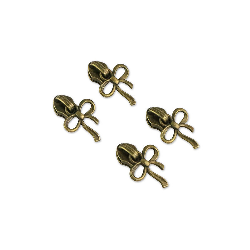 A pack of the Four #5 bow Zipper Pulls, isolated on a white background.