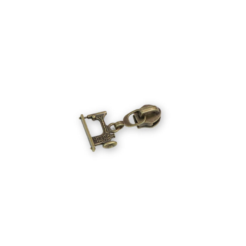 A #5 sewing machine Zipper Pull, isolated on a white background.