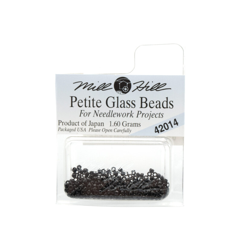 A package of Mill Hill Petite Seed Beads in the color black. 